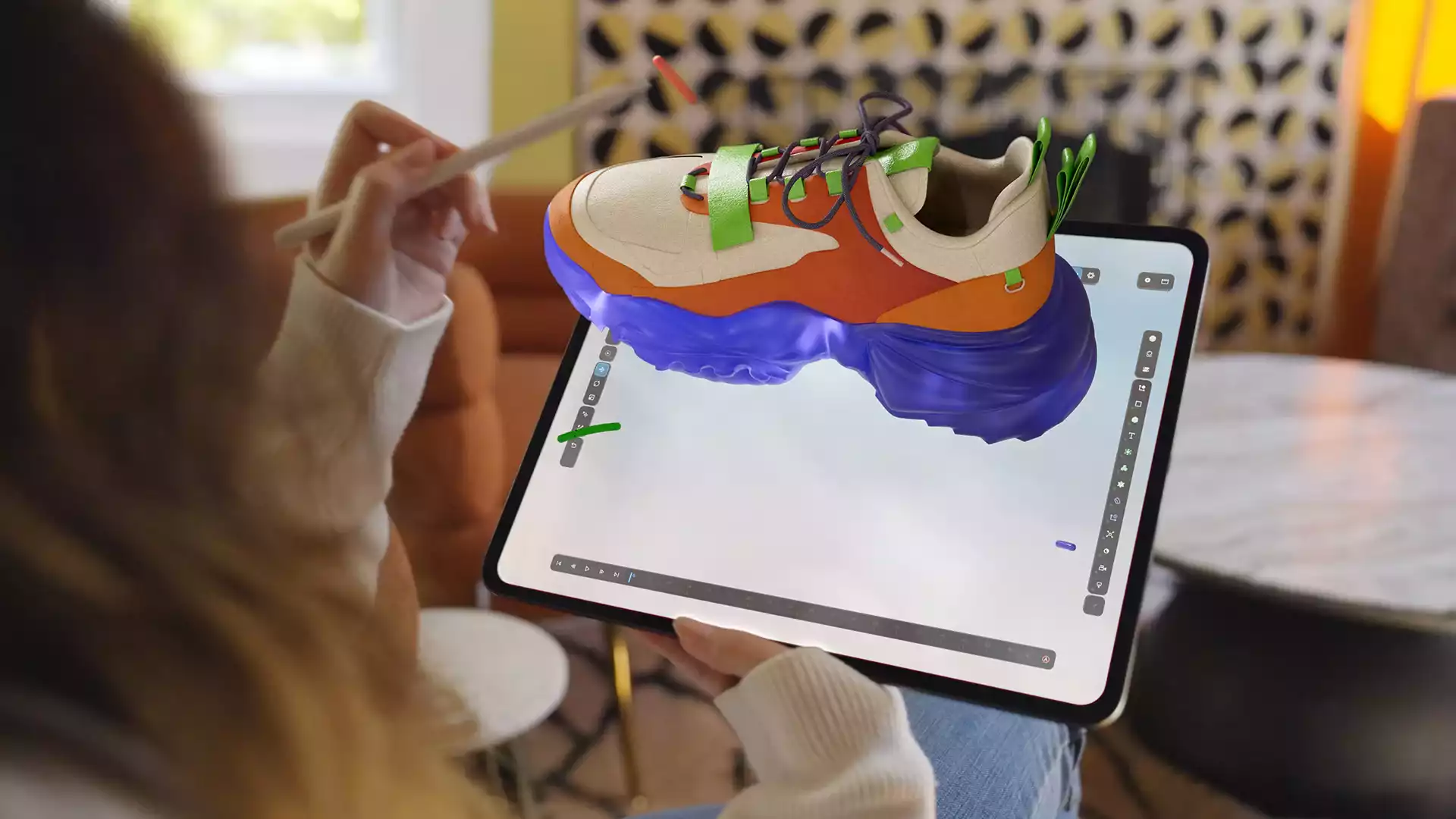 Artist using Cinema 4D cross-platform workflow on tablet and desktop